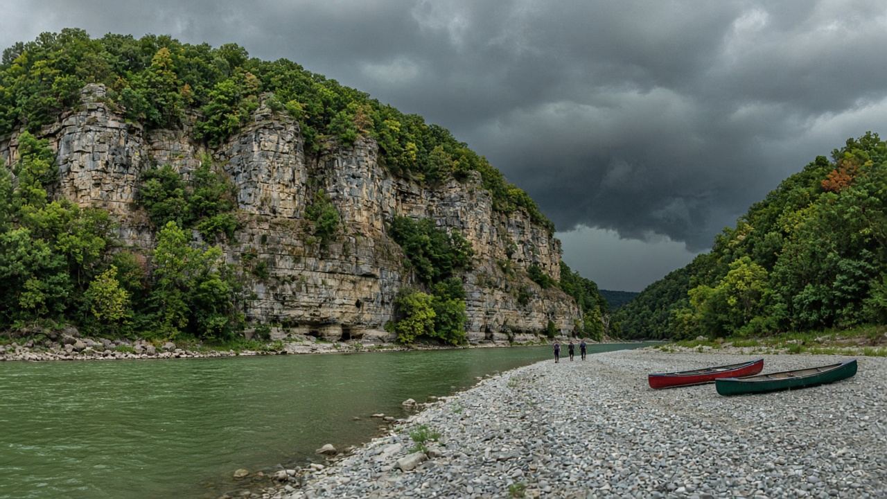 Storm clouds over the bluffs with canoes pulled high on a gravel bar