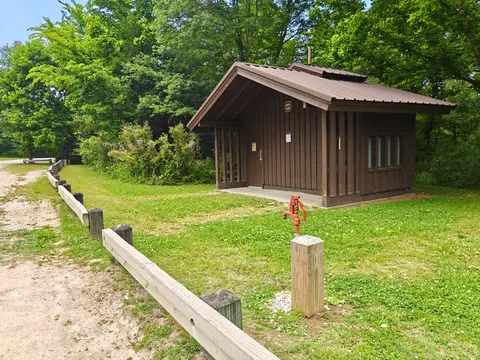 Restroom building and water spigot at Erbie campground
