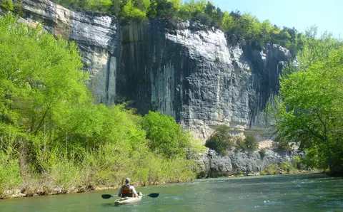 A kayaker paddling the Upper District of the Buffalo River